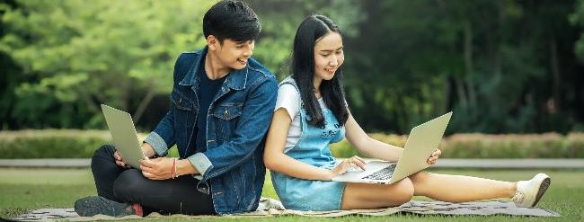 two people sitting outside