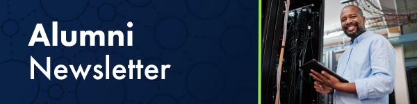 "Alumni Newsletter" text with a smiling man holding a tablet in a server room.