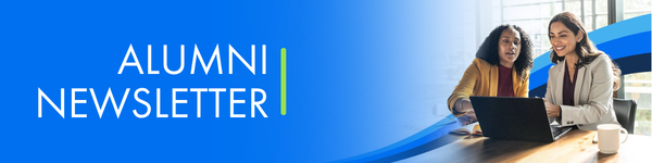 Alumni Newsletter banner with two women collaborating over a laptop in a bright office.