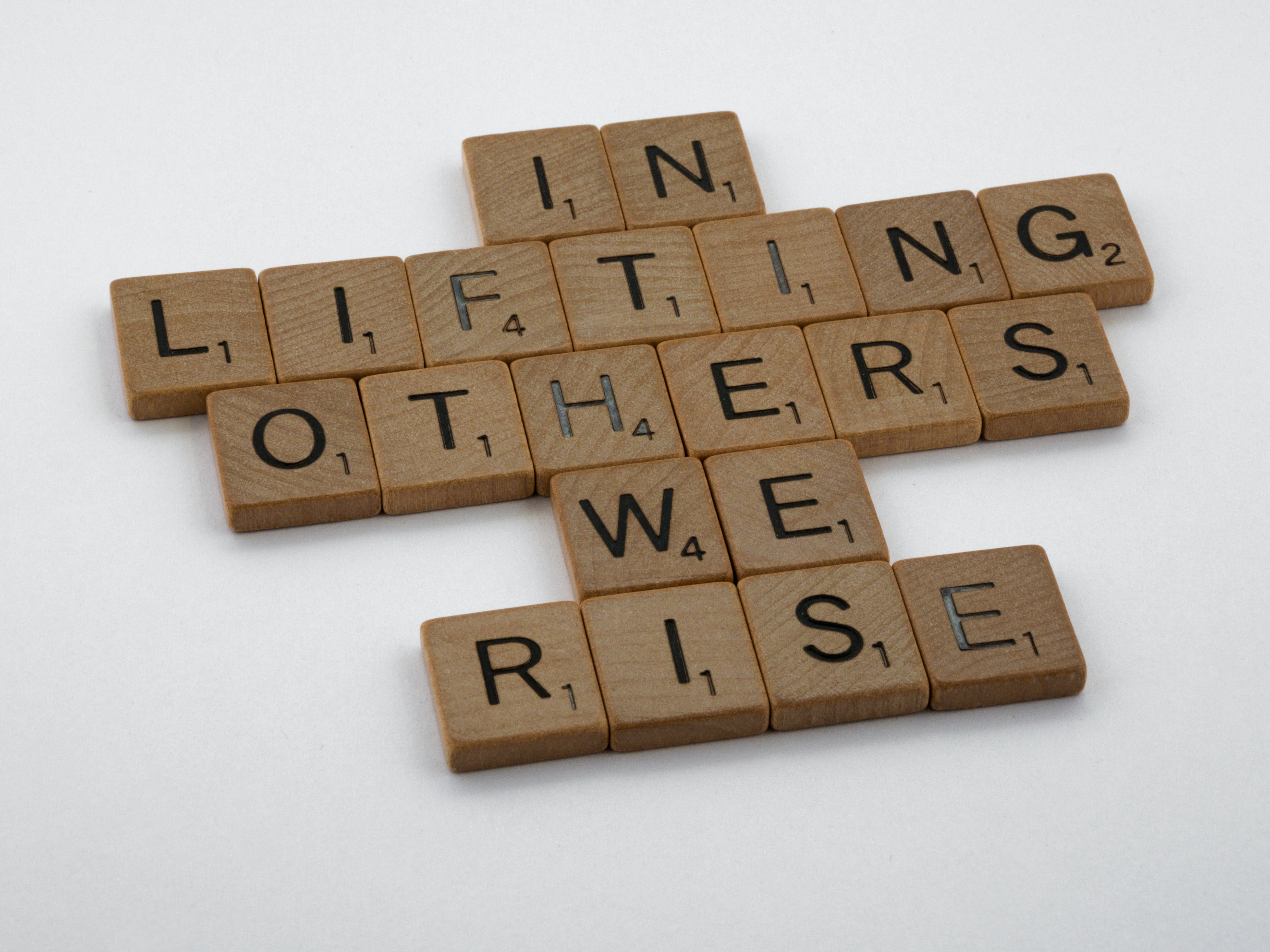 In Lifting Others We Rise