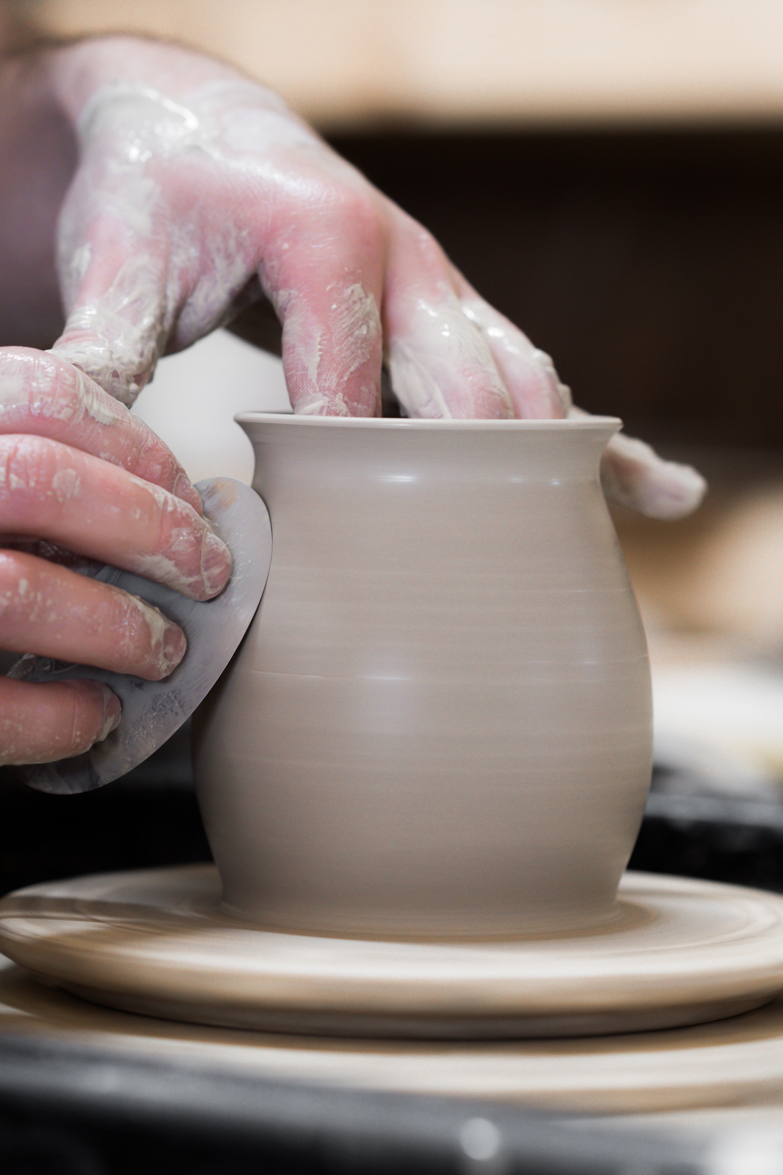 Clay pot being sculpted