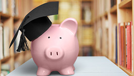 piggy bank and diploma