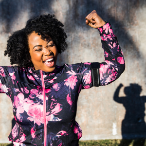 Woman with hands raised in triumph