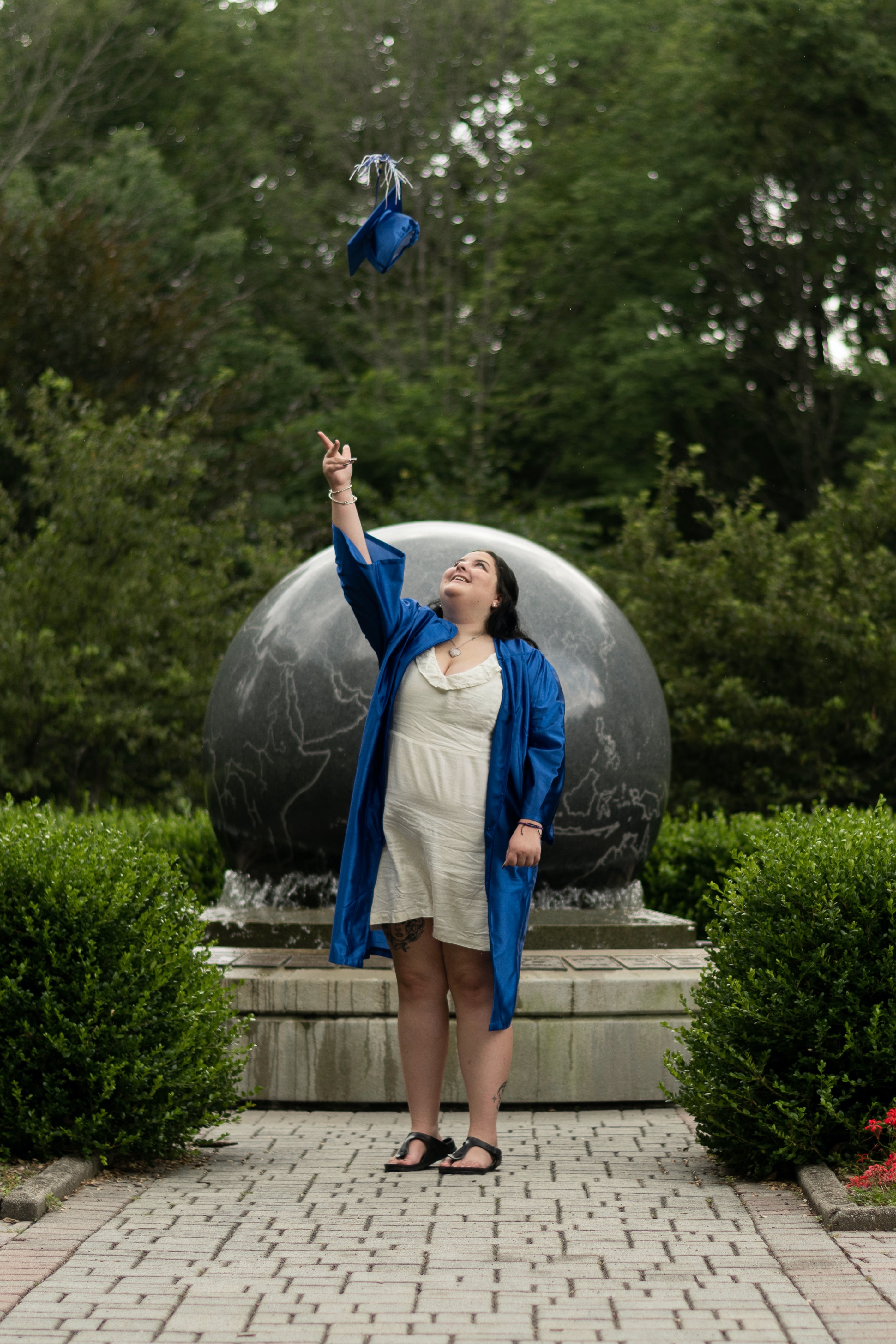 grad tossing cap