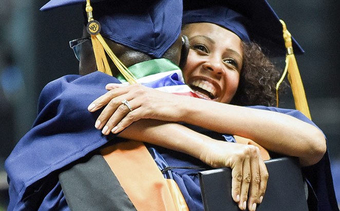 Graduates hugging