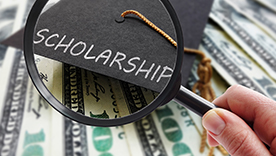 Scholarship Magnifying glass over money